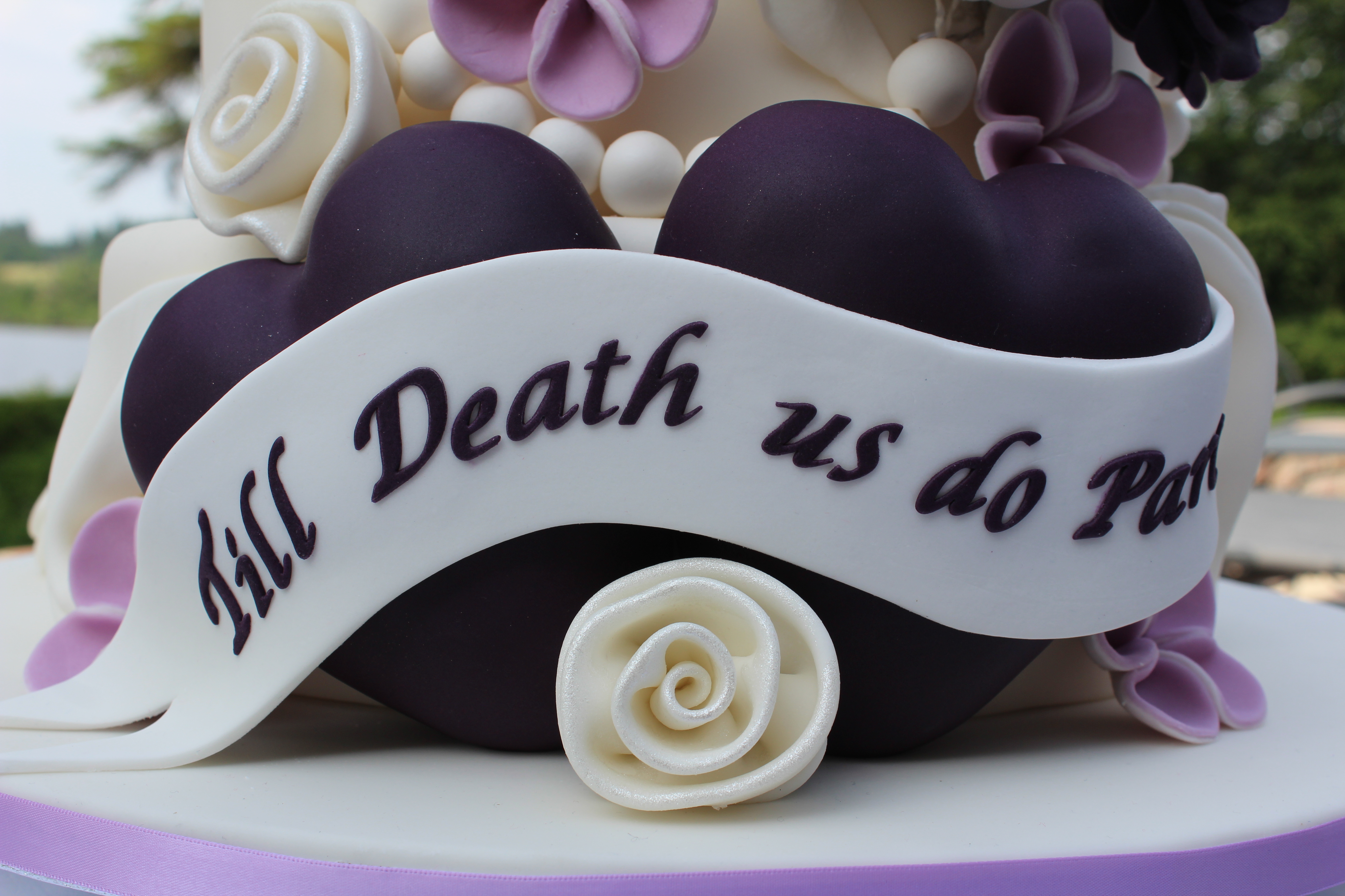 Closup of hearts on the bottom of the cake