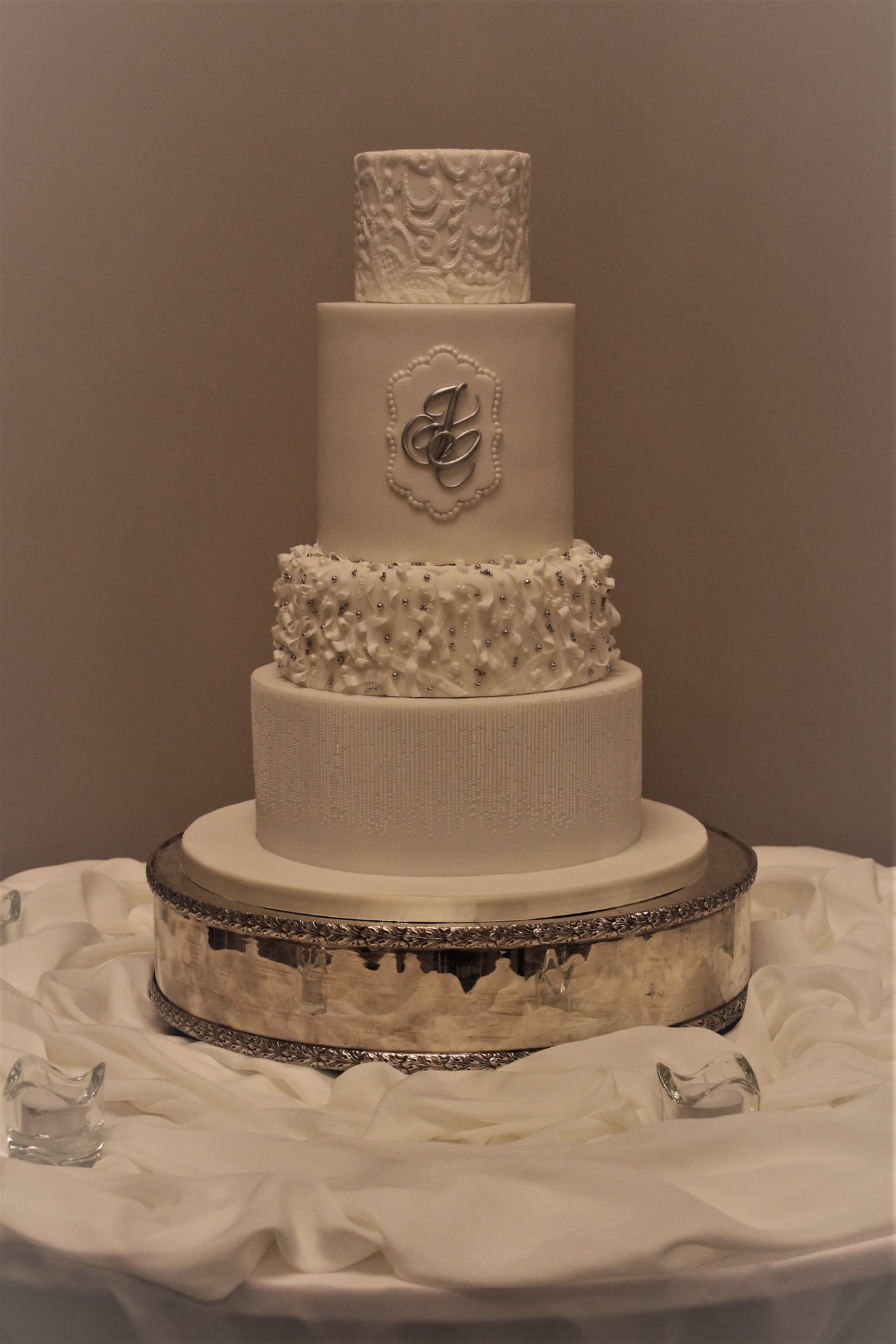 Four tiered white wedding cake